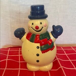 Cheerful plastic snowman with scarf holiday fav